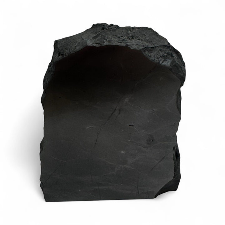 Medium one-face polished shungite stone with natural rough edges, used for EMF protection, grounding, and energy balance.