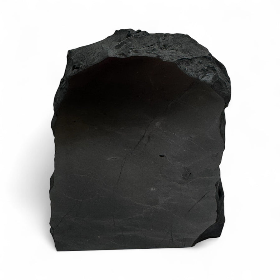 Medium one-face polished shungite stone with natural rough edges, used for EMF protection, grounding, and energy balance.