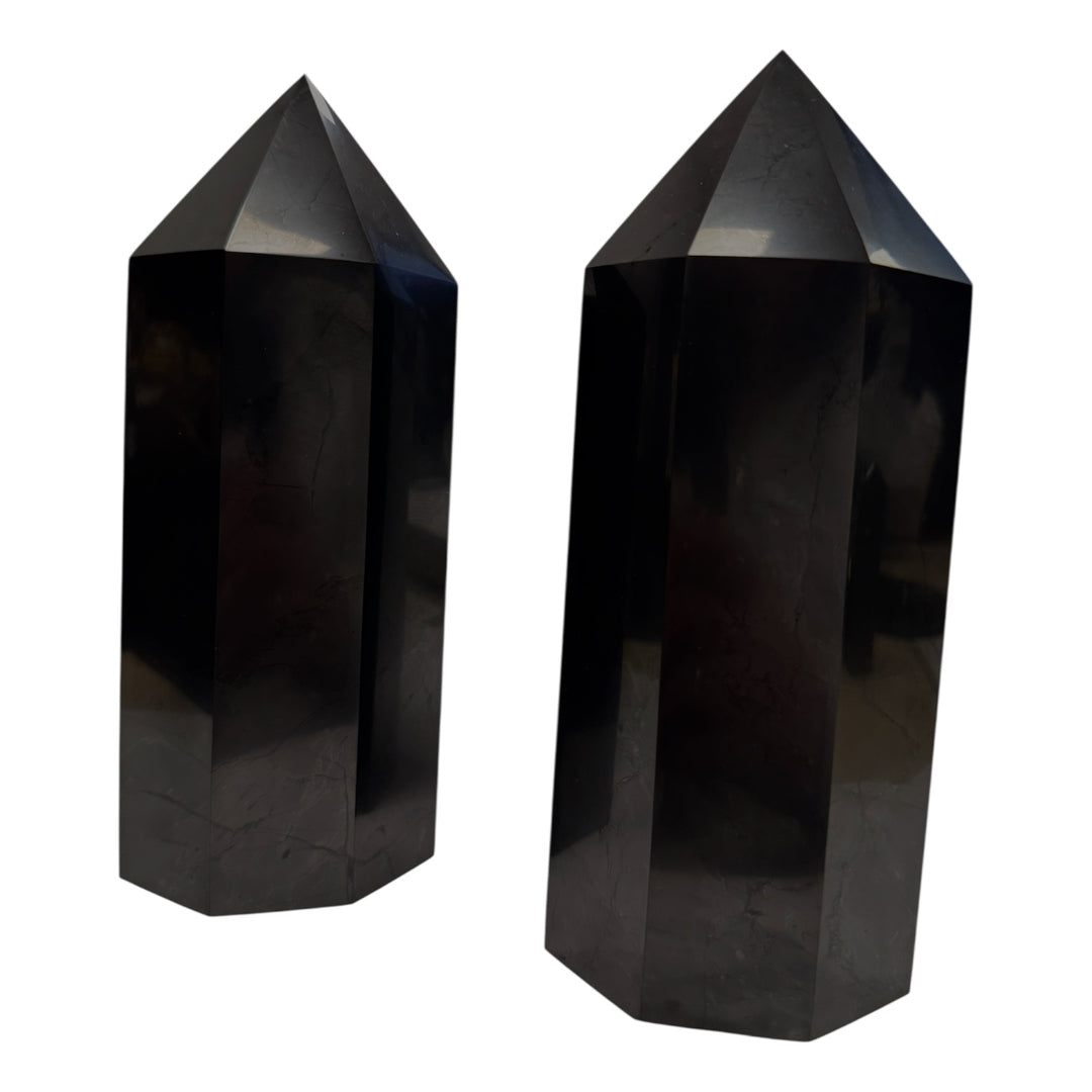 Pair of large polished shungite towers, approximately 20cm, used for powerful energy balancing and space cleansing.