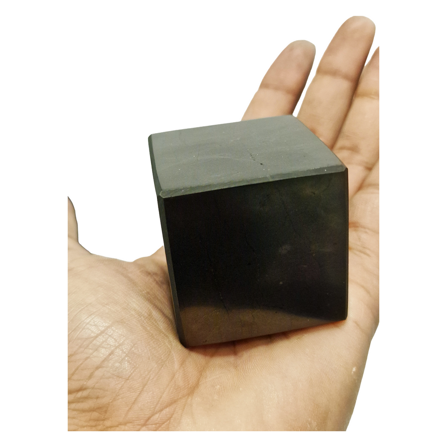 Shungite 40mm Cube on hand for size reference, grounding and EMF protection crystal