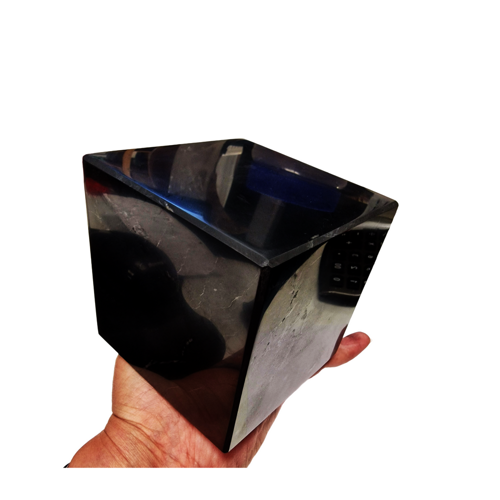 Shungite 10cm Cube on hand for size reference, grounding and EMF protection crystal