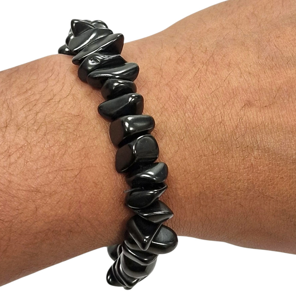 Shungite gem chip bracelet on hand, grounding crystal jewellery for EMF protection and balance