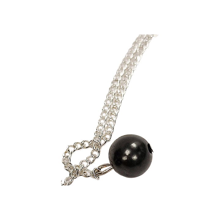 Close-up image of Shungite holding bead with silver chain, detail of smooth polished pendulum design