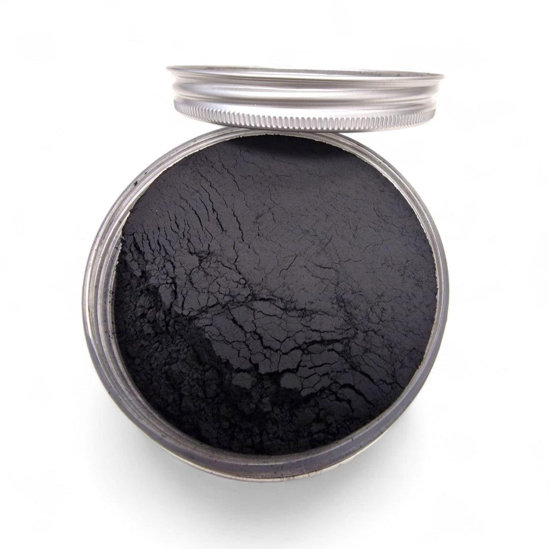 Minimalist photo of Shungite powder on white background, pure cosmetic grade mineral