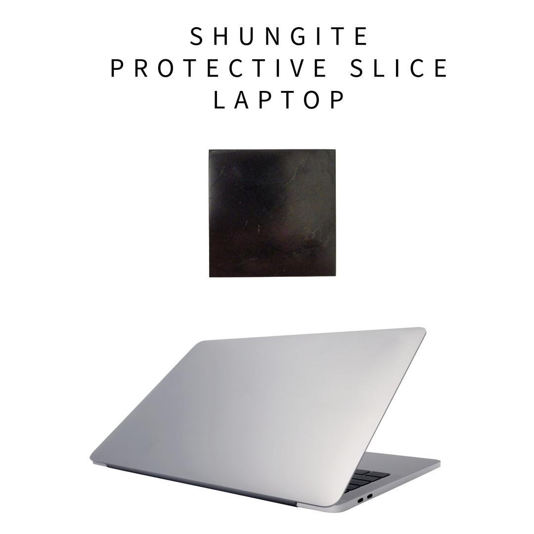 Shungite protective square slice applied to back of laptop lid in clean home office environment