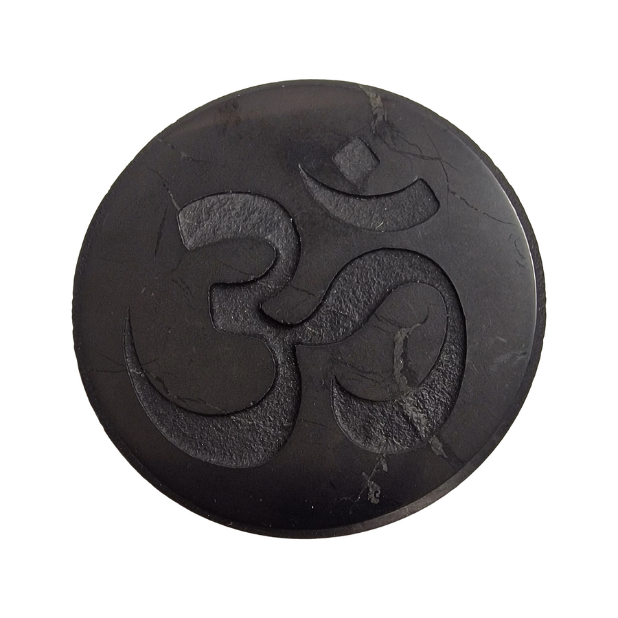 Shungite round 50mm Ohm slice on white background, spiritual harmony and energy balancing crystal
