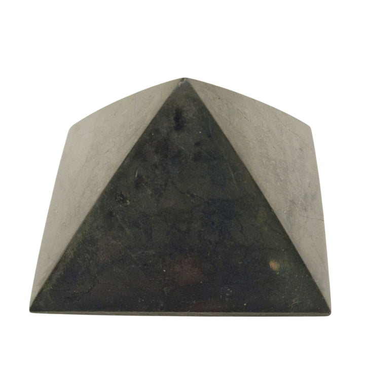 Side view of Shungite 40mm Pyramid on white background, grounding stone for EMF shielding