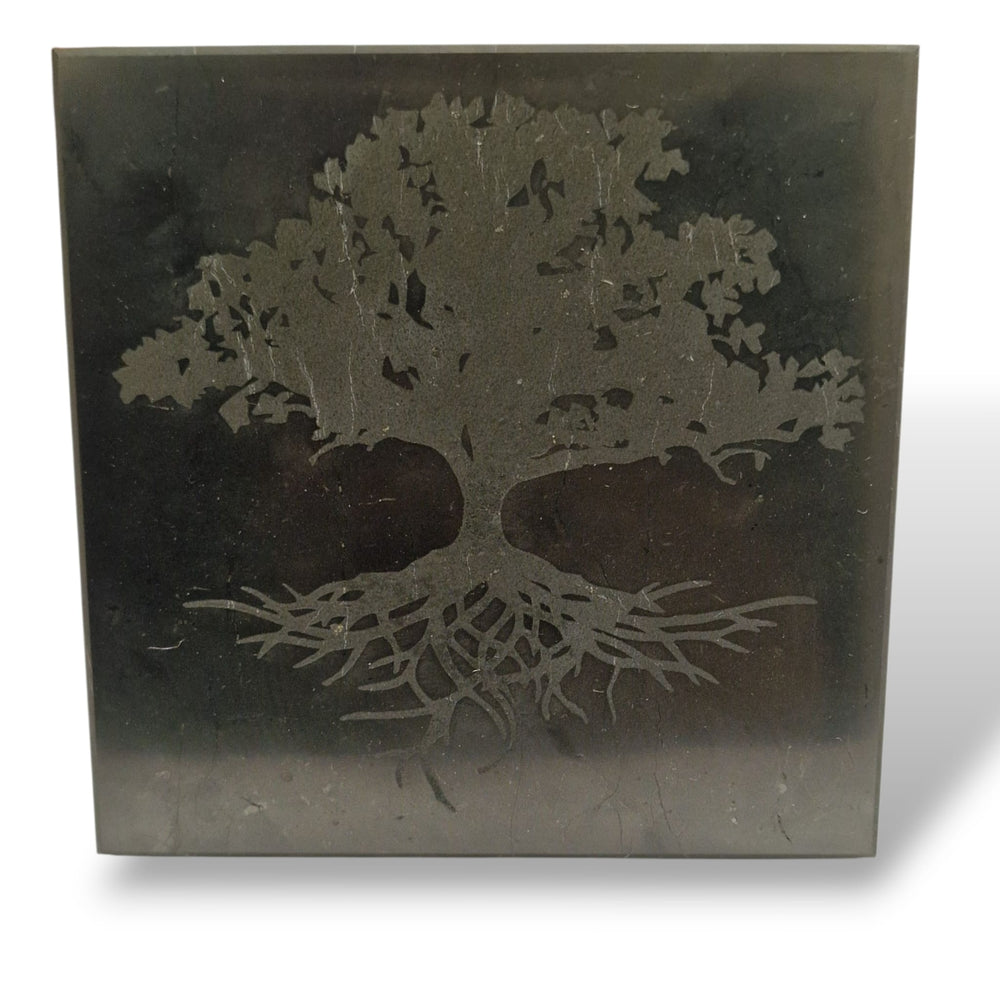 Side view of Shungite 10cm square Tree of Life charging disc on white background, grounding crystal for EMF shielding and cleansing