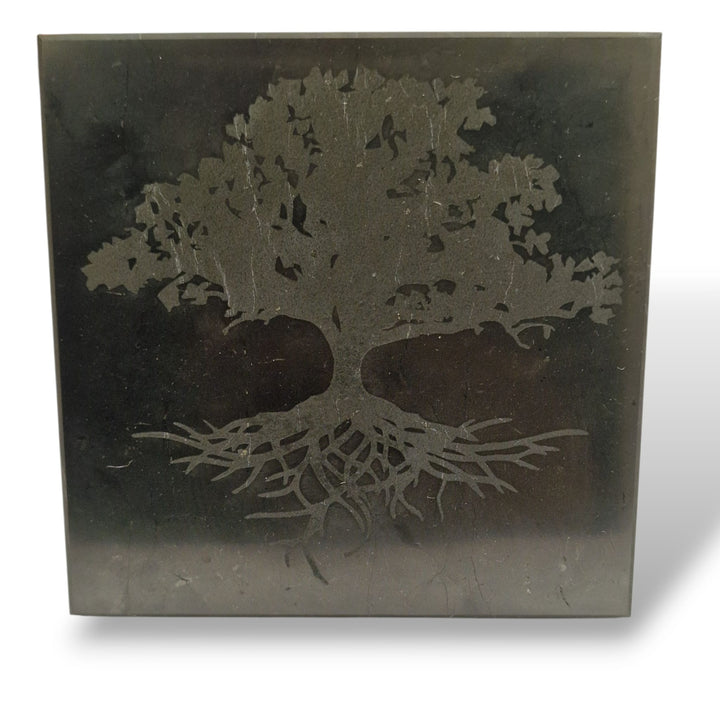 Side view of Shungite 10cm square Tree of Life charging disc on white background, grounding crystal for EMF shielding and cleansing