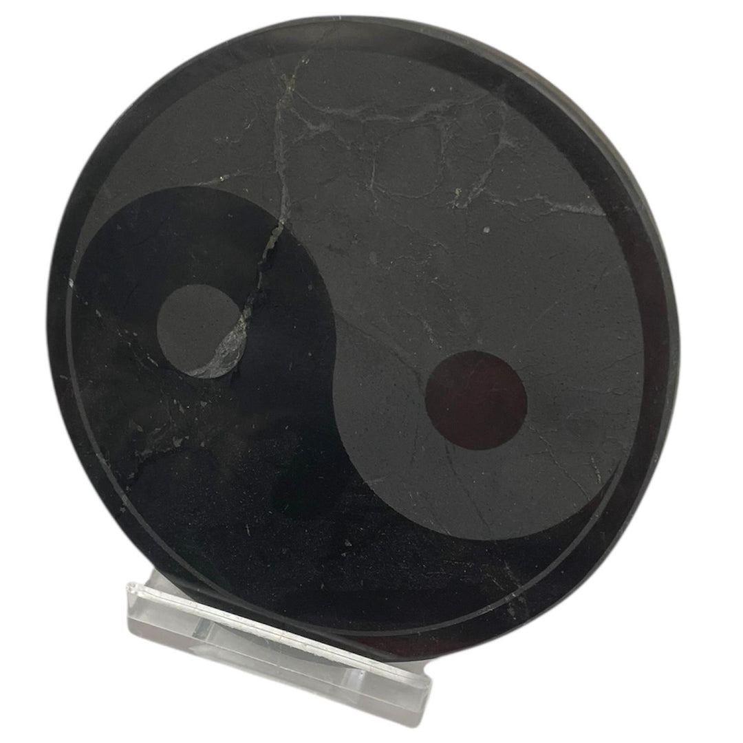 Round Shungite disc with Yin Yang design for charging crystals and clearing energy