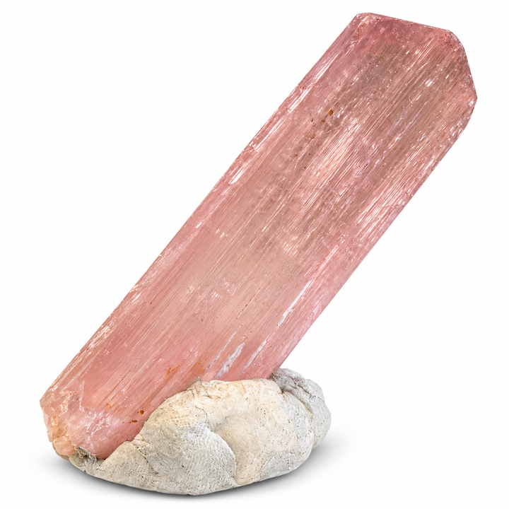 Natural pink Spodumene crystal from Nuristan, Afghanistan, featuring an elongated prismatic formation, delicate longitudinal striations and soft lilac-pink tones. A.P. Castleton Collection.