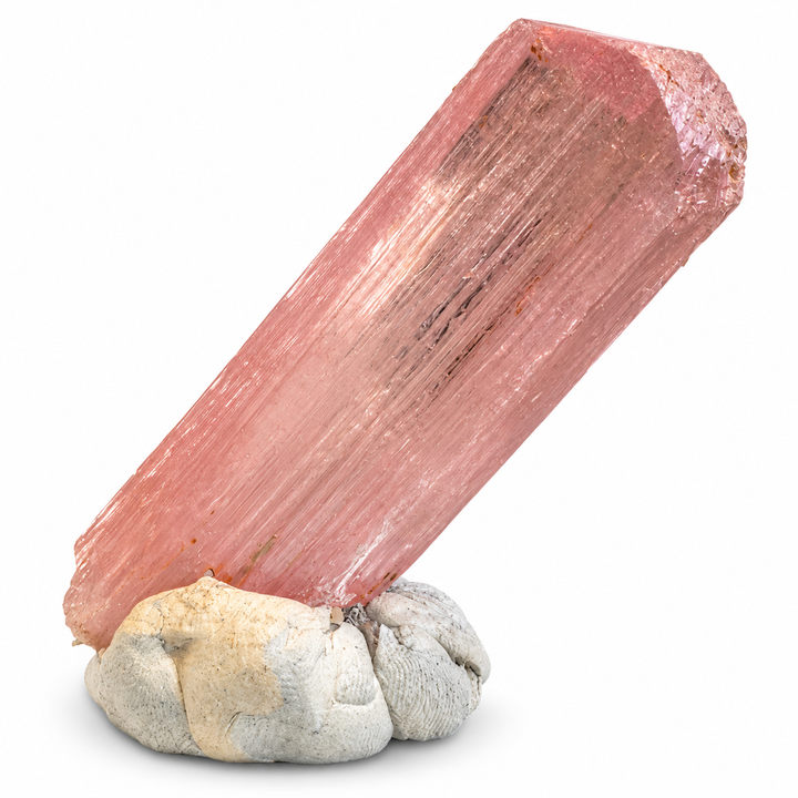 Natural pink Spodumene crystal from Nuristan, Afghanistan, featuring an elongated prismatic formation, delicate longitudinal striations and soft lilac-pink tones. A.P. Castleton Collection.