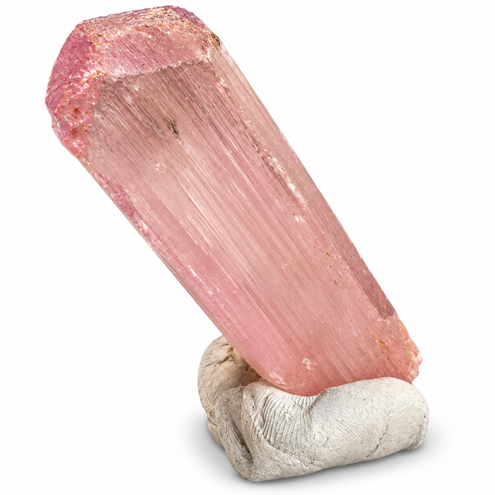 Natural pink Spodumene crystal from Nuristan, Afghanistan, featuring an elongated prismatic formation, delicate longitudinal striations and soft lilac-pink tones. A.P. Castleton Collection.