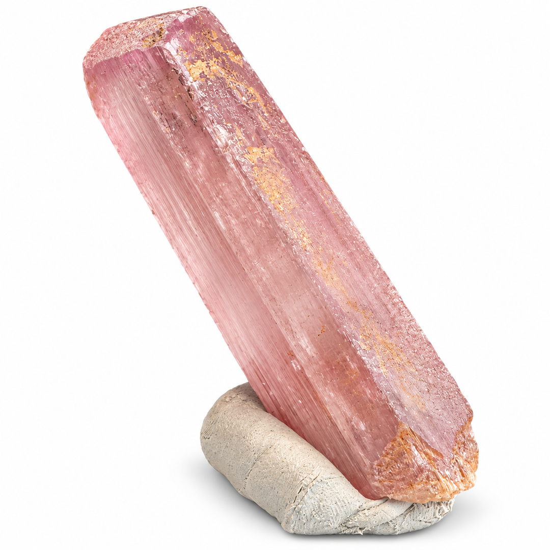 Natural pink Spodumene crystal from Nuristan, Afghanistan, featuring an elongated prismatic formation, delicate longitudinal striations and soft lilac-pink tones. A.P. Castleton Collection.