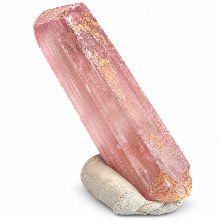 Natural pink Spodumene crystal from Nuristan, Afghanistan, featuring an elongated prismatic formation, delicate longitudinal striations and soft lilac-pink tones. A.P. Castleton Collection.