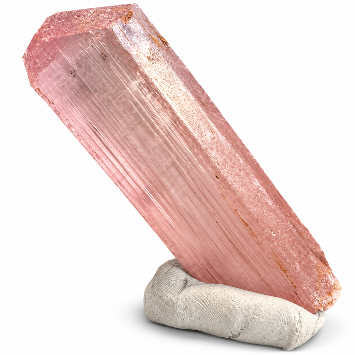 Natural pink Spodumene crystal from Nuristan, Afghanistan, featuring an elongated prismatic formation, delicate longitudinal striations and soft lilac-pink tones. A.P. Castleton Collection.