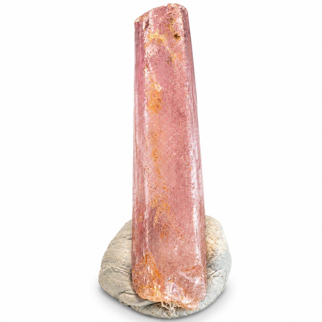 Natural pink Spodumene crystal from Nuristan, Afghanistan, featuring an elongated prismatic formation, delicate longitudinal striations and soft lilac-pink tones. A.P. Castleton Collection.