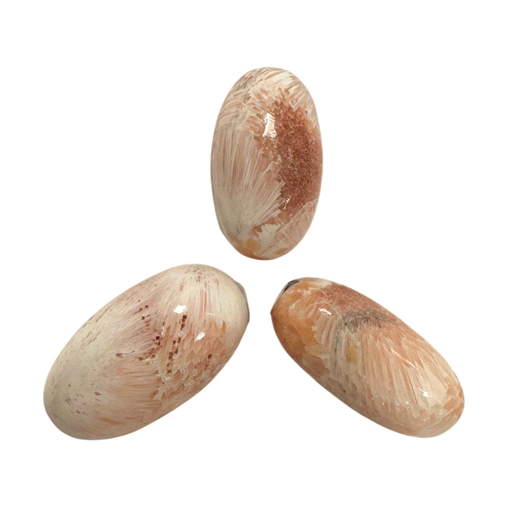 GeoFossils Stilbite in Scolecite Shiva Lingham – exact crystal shown, polished pink and white zeolite crystal for peace, compassion, and spiritual growth.