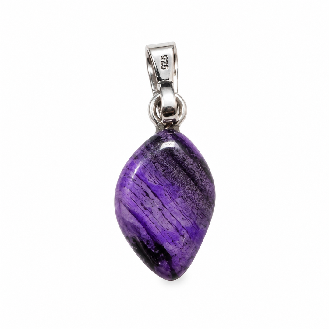 GeoFossils Sugilite pendant showing the reverse of the polished purple gemstone, with natural dark markings and a sterling silver bail against a white background.