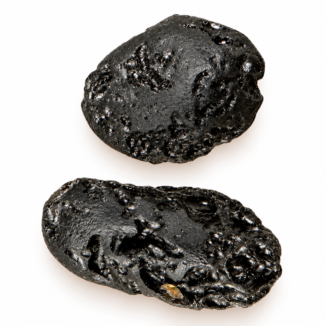 GeoFossils 18g Tibetan tektite specimens displaying a glossy black surface with pronounced grooves and natural pitting.