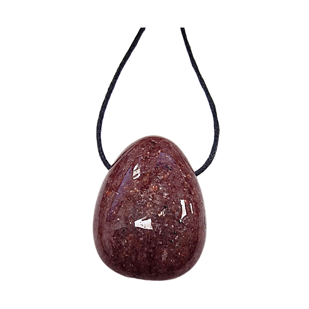 Polished Strawberry Quartz drilled tumble stone on a black vegan cotton cord, shimmering with pink inclusions and ready to wear as a heart chakra pendant.