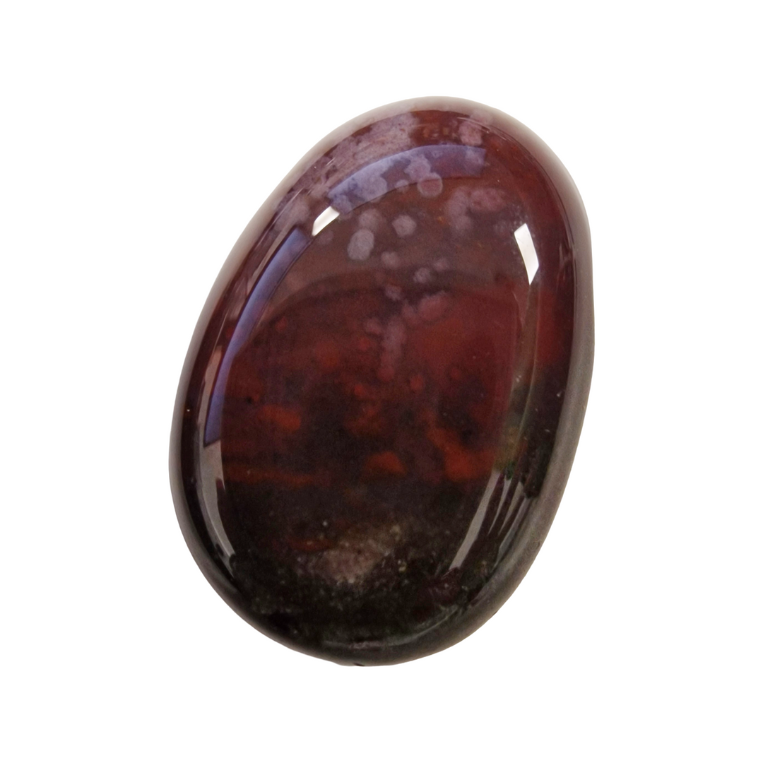 Grounding Sardonyx drilled crystal tumble, linked to courage, protection, and emotional stability.