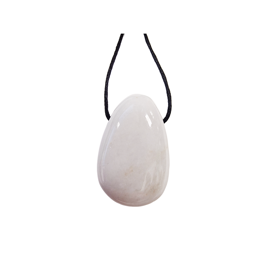 Polished White Onyx drilled tumble stone on a black vegan cotton cord, glowing with soft ivory tones, perfect for peaceful focus and everyday wear.
