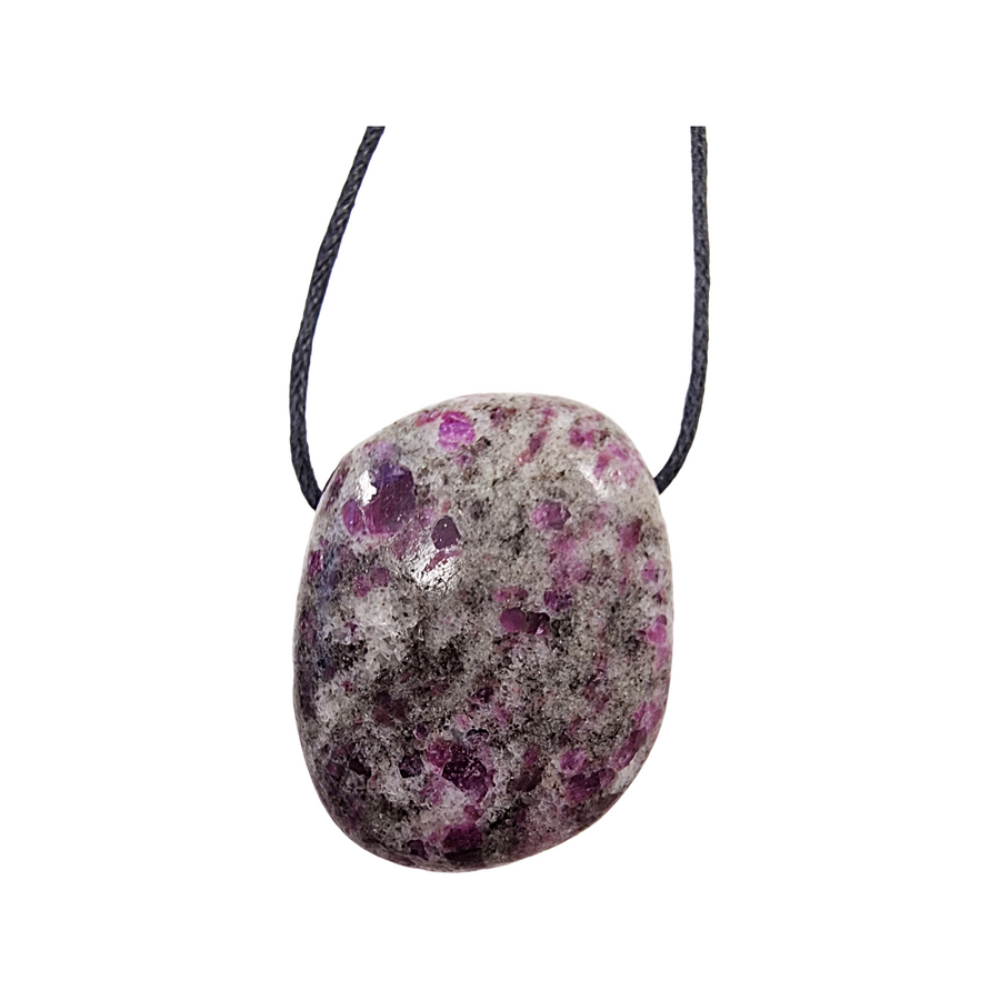 Ruby in Feldspar drilled tumble stone on a black vegan cotton cord, featuring vibrant pink-red ruby inclusions set in creamy feldspar matrix, ideal for heart energy and self-empowerment.