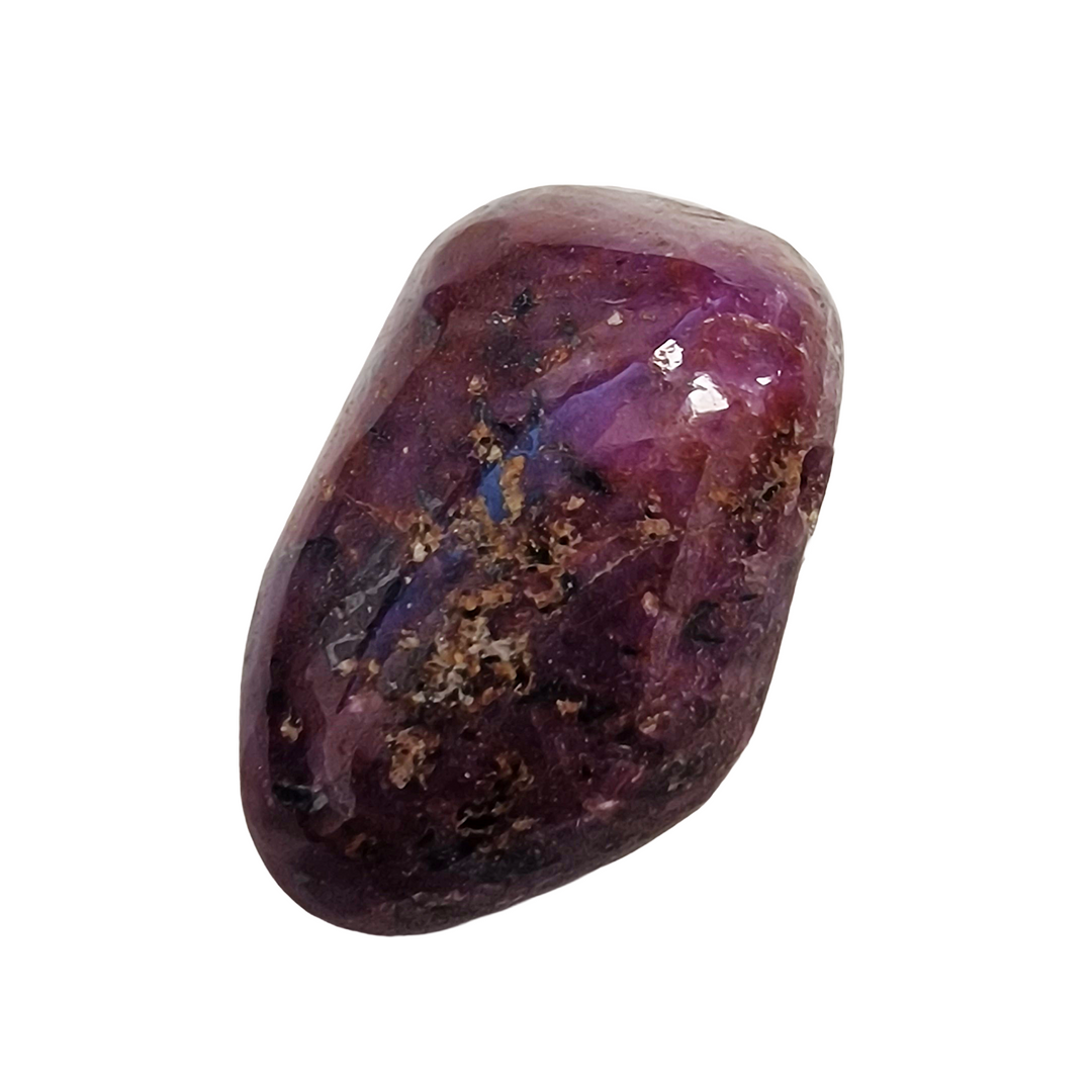 Drilled Ruby tumble stone, hand-polished and energised for love, confidence, and inner strength.