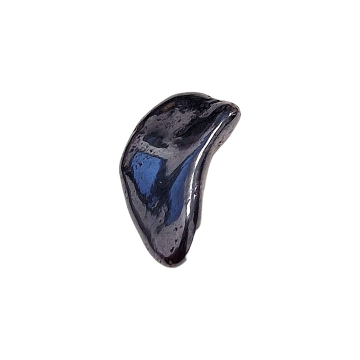 GeoFossils Manganese Tumble Stone, a metallic black grounding crystal for emotional strength, protection, and energetic stability.