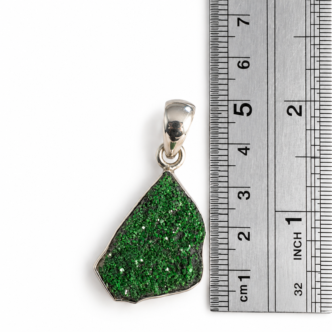 GeoFossils Uvarovite Garnet pendant beside a centimetre ruler, measuring approximately 4 cm in total length including the 925 sterling silver bail.