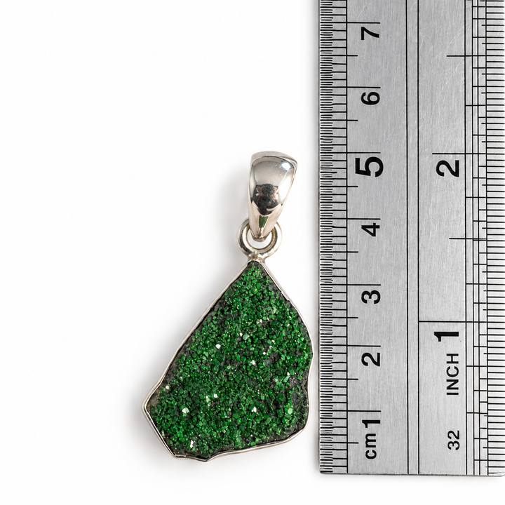 GeoFossils Uvarovite Garnet pendant beside a centimetre ruler, measuring approximately 4 cm in total length including the 925 sterling silver bail.