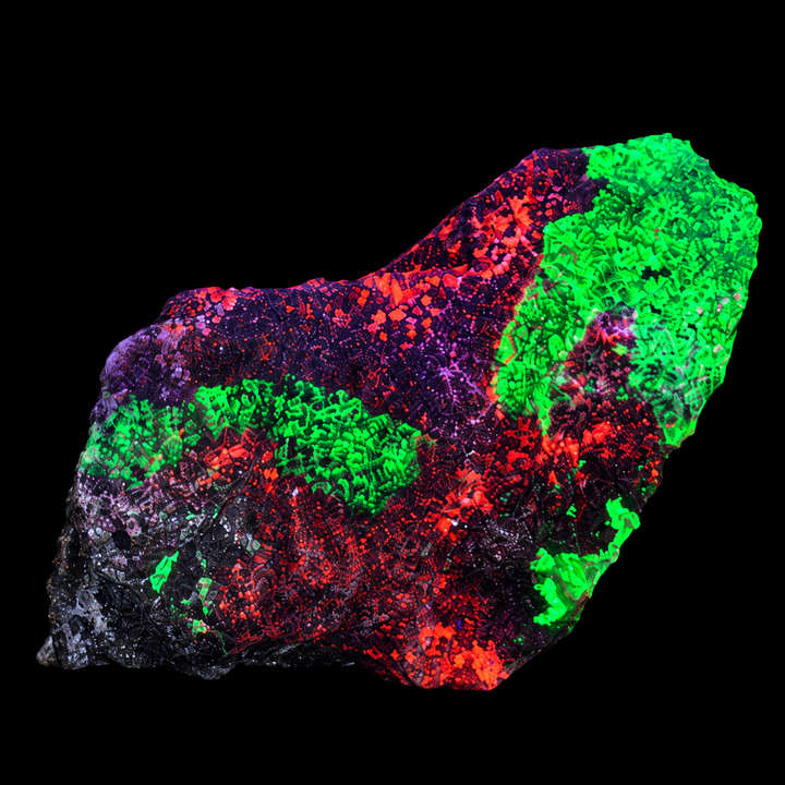 GeoFossils Willemite with Mangano Calcite Specimen 152 displaying orange and green fluorescence under UV light