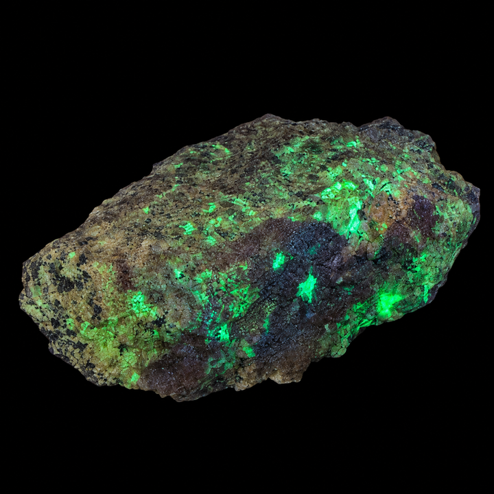 GeoFossils Willemite with Mangano Calcite Specimen 154 displaying green fluorescence under UV light