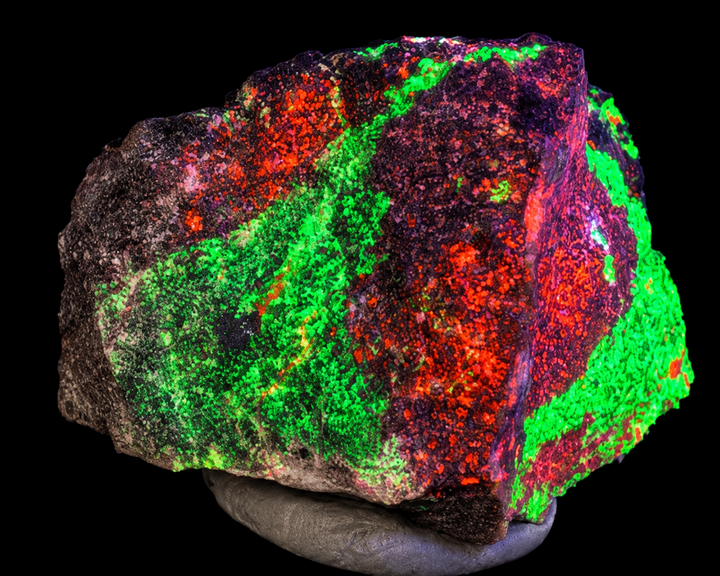 GeoFossils Willemite with Mangano Calcite Specimen 158 displaying green and orange fluorescence under UV light