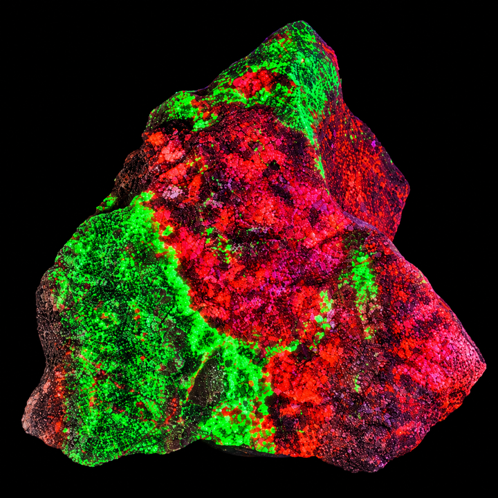 GeoFossils Willemite with Mangano Calcite Specimen 159 displaying green and orange fluorescence under UV light