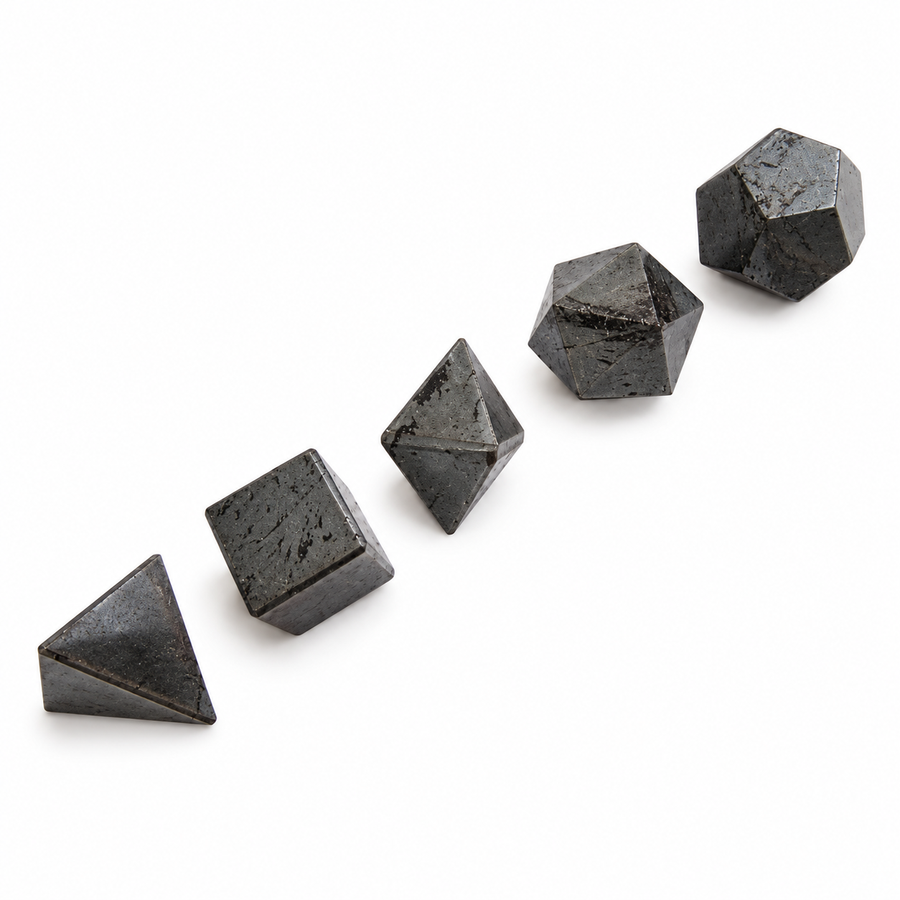 Five dark metallic-grey Hematite Platonic solids arranged diagonally on a white background — GeoFossils.