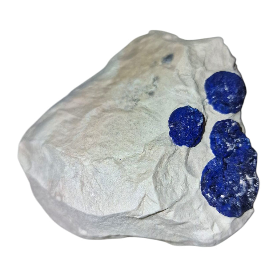 GeoFossils Azurite Sun – a rare, circular deep blue crystal formation from the Malbunka Copper Mine, Australia, with radiant patterns resembling the sun. Associated with the Third Eye and Throat Chakras, intuition, spiritual insight, and communication.