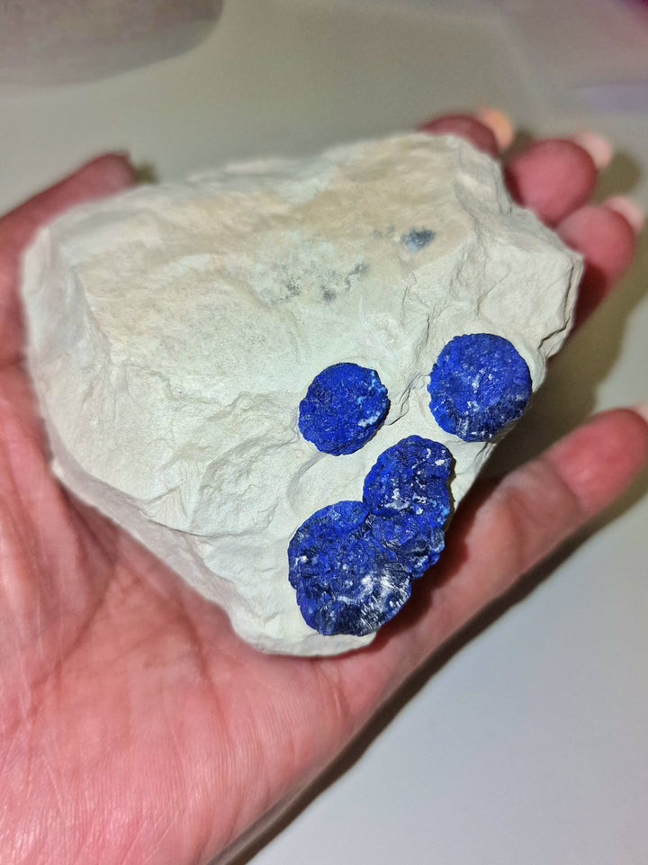 GeoFossils Azurite Sun – a rare, circular deep blue crystal formation from the Malbunka Copper Mine, Australia, with radiant patterns resembling the sun. Associated with the Third Eye and Throat Chakras, intuition, spiritual insight, and communication.