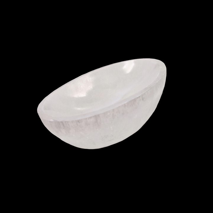 Selenite Oval Charging Bowl 10 cm shown on black background.