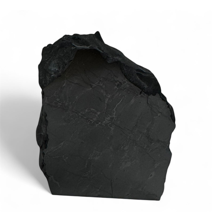 One-face polished shungite stone with natural rough edges, known for EMF protection, energy balance, and healing properties.