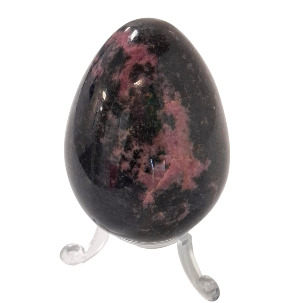 Polished Rhodonite crystal egg with included stand, symbol of emotional healing and heart chakra balance