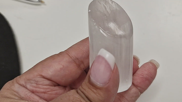 13-second video of a 6 cm Selenite Lipstick Tower shown in hand, rotated to display all sides and the slanted polished top.
