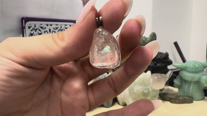 GeoFossils Morganite Tumblestone Pendant featuring a polished, translucent blush-pink gemstone with natural inclusions and a sterling silver bail, shown from multiple angles to highlight its shape, clarity and natural characteristics.