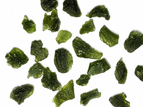 Rotating video of the exact Raw Moldavite specimen showing its natural colour, sculptured surface textures and overall form from multiple angles.