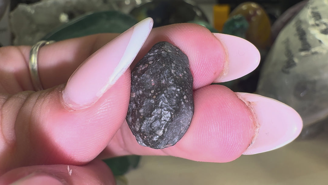 Rotating video of the exact NWA 13683 Rumuruti Chondrite specimen showing its natural exterior, geological texture and overall appearance from multiple angles.