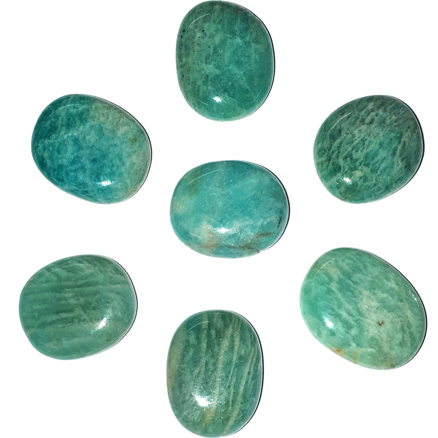 A collection of Handmade Amazonite Mini Ovals, displaying soft green and blue hues. Each oval is polished and designed for easy carrying, offering calming and balancing energies for emotional healing and clear communication. Perfect for pocket stones or spiritual practices.