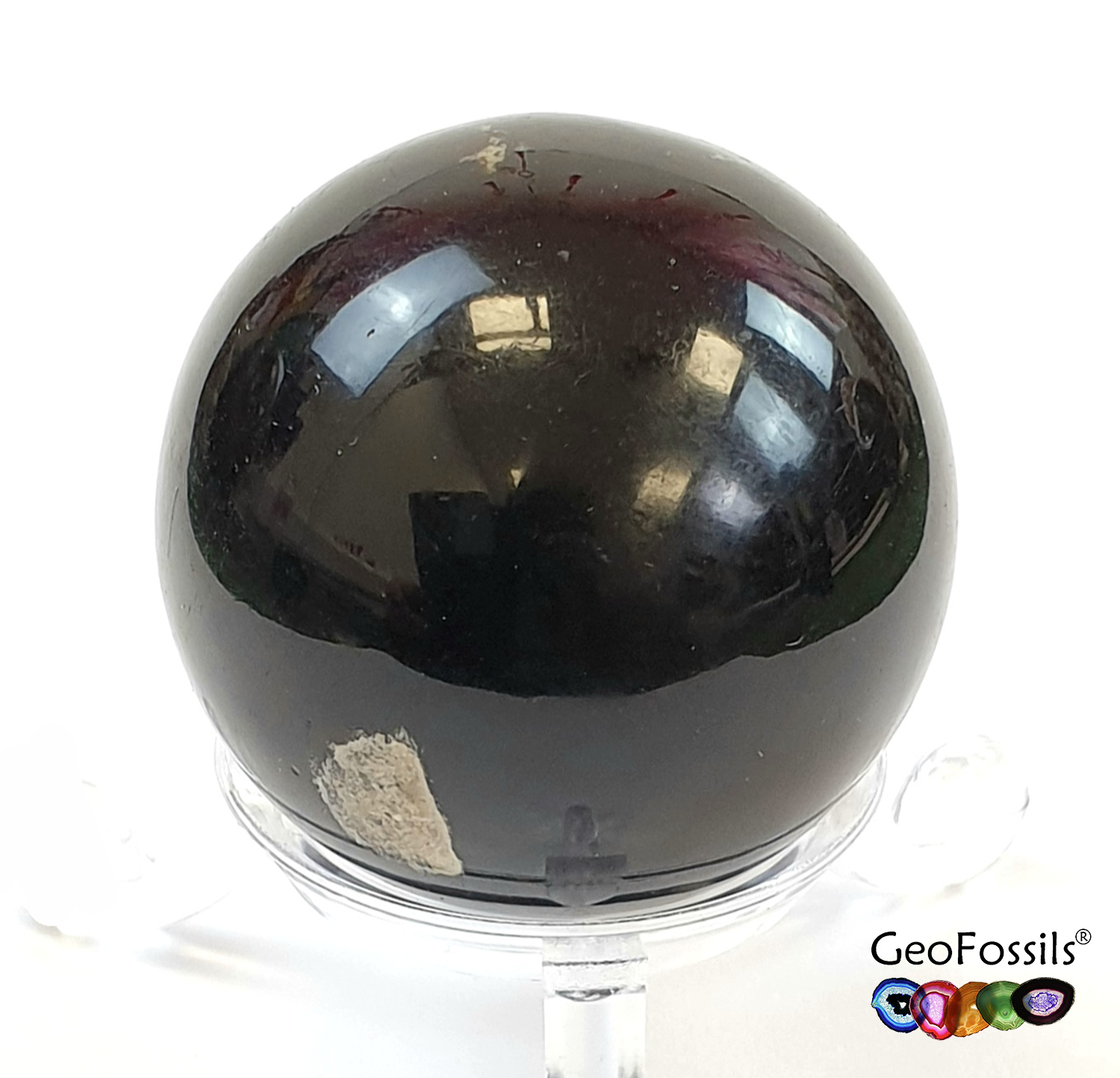 GeoFossils Blue Amber Sphere from the Dominican Republic, a rare fossilised resin with a stunning blue fluorescence for intuition, transformation, and protection.