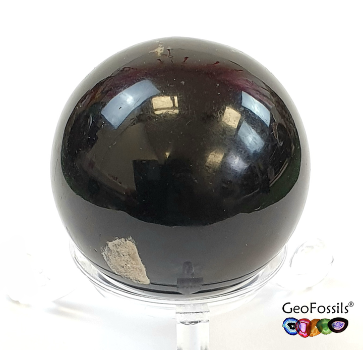 GeoFossils Blue Amber Sphere from the Dominican Republic, a rare fossilised resin with a stunning blue fluorescence for intuition, transformation, and protection.