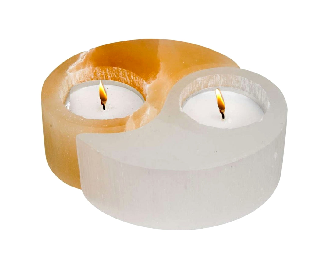Selenite Yin Yang Tealight Holder carved from white and peach selenite, glowing with symbolic harmony and calming energy.